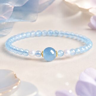 Aqualume Blue Focal Bracelet — 4 mm, pale-blue finished stretch bracelet shown in full