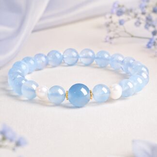Aqualume Blue Focal Bracelet — 8 mm, pale-blue finished stretch bracelet shown in full