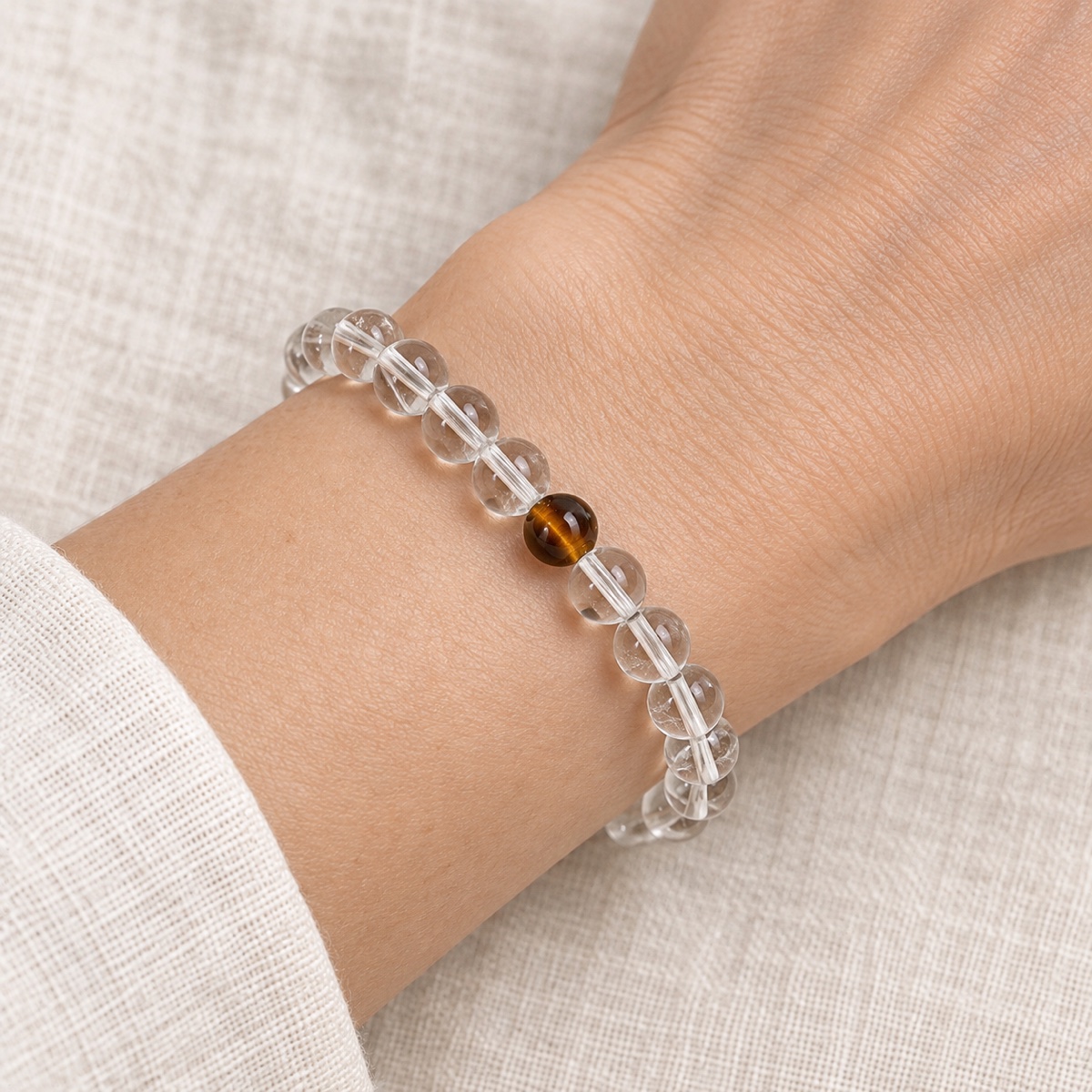 Luminelle Clear Bead Bracelet — Tiger-Eye Brown, 6 mm worn on wrist