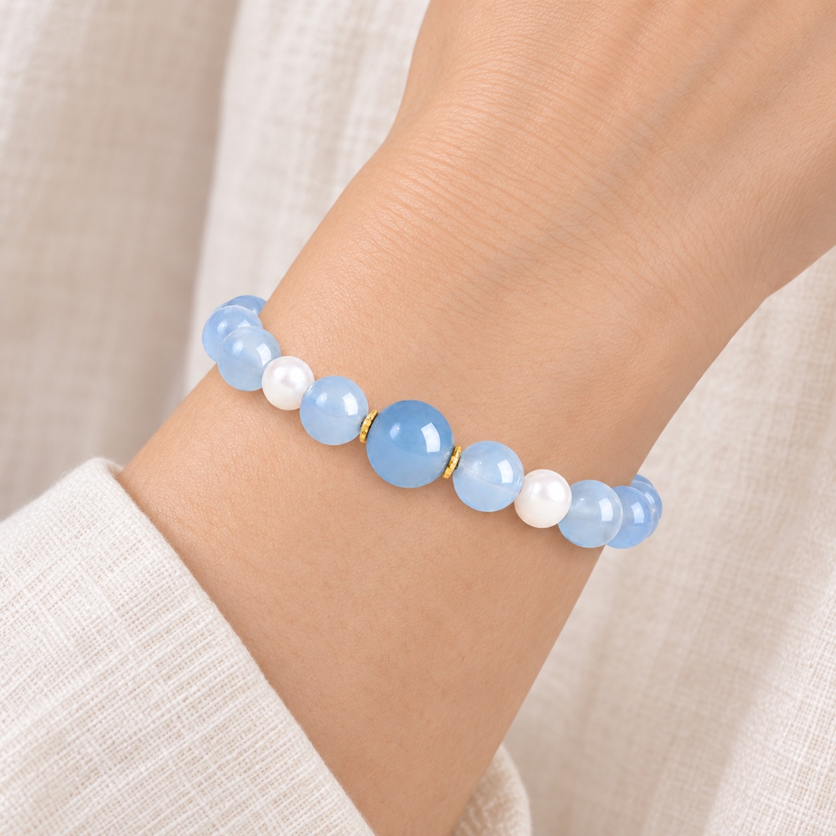 Aqualume Blue Focal Bracelet — 8 mm worn on wrist