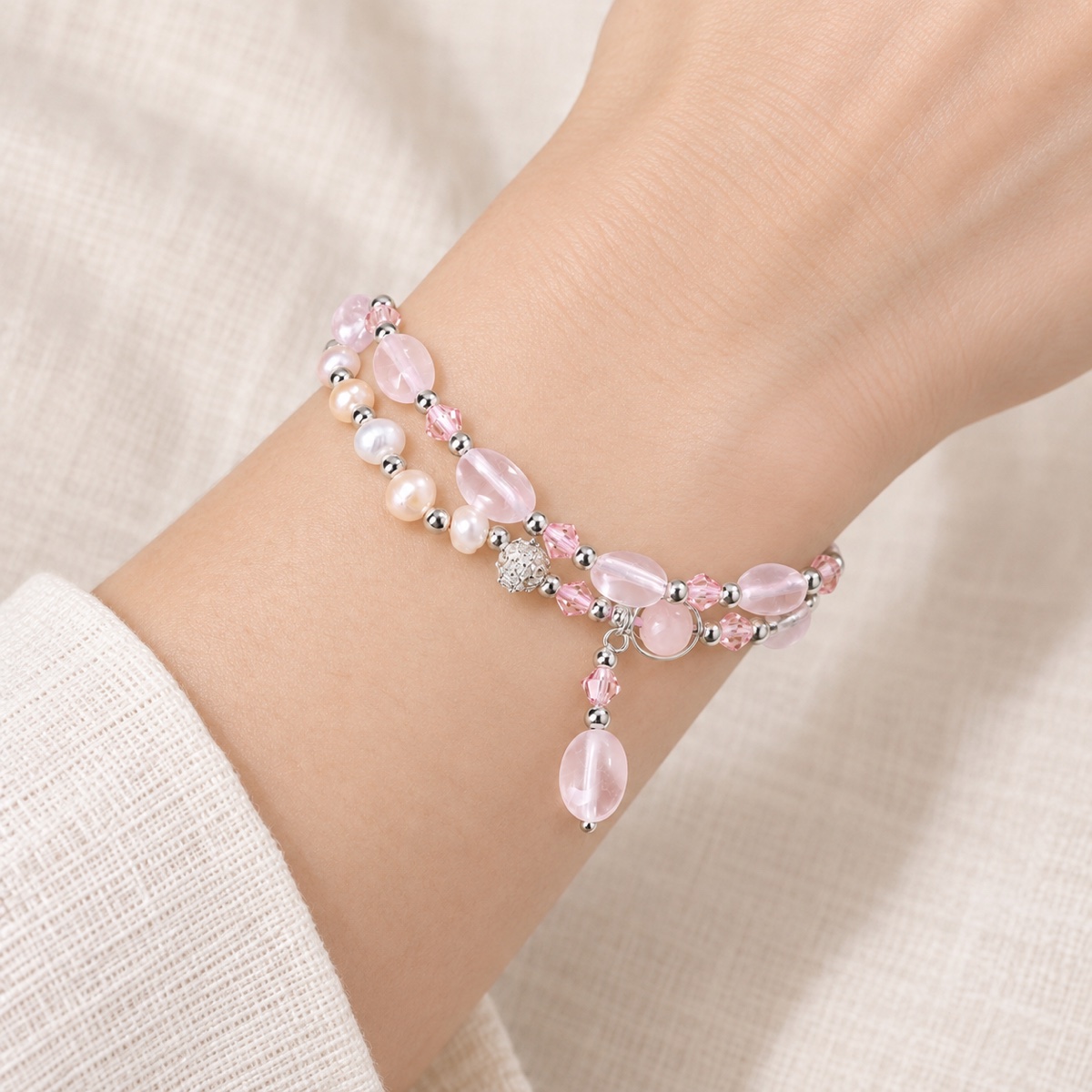 Roselight Pearl Drop Double-Strand Bracelet worn on wrist
