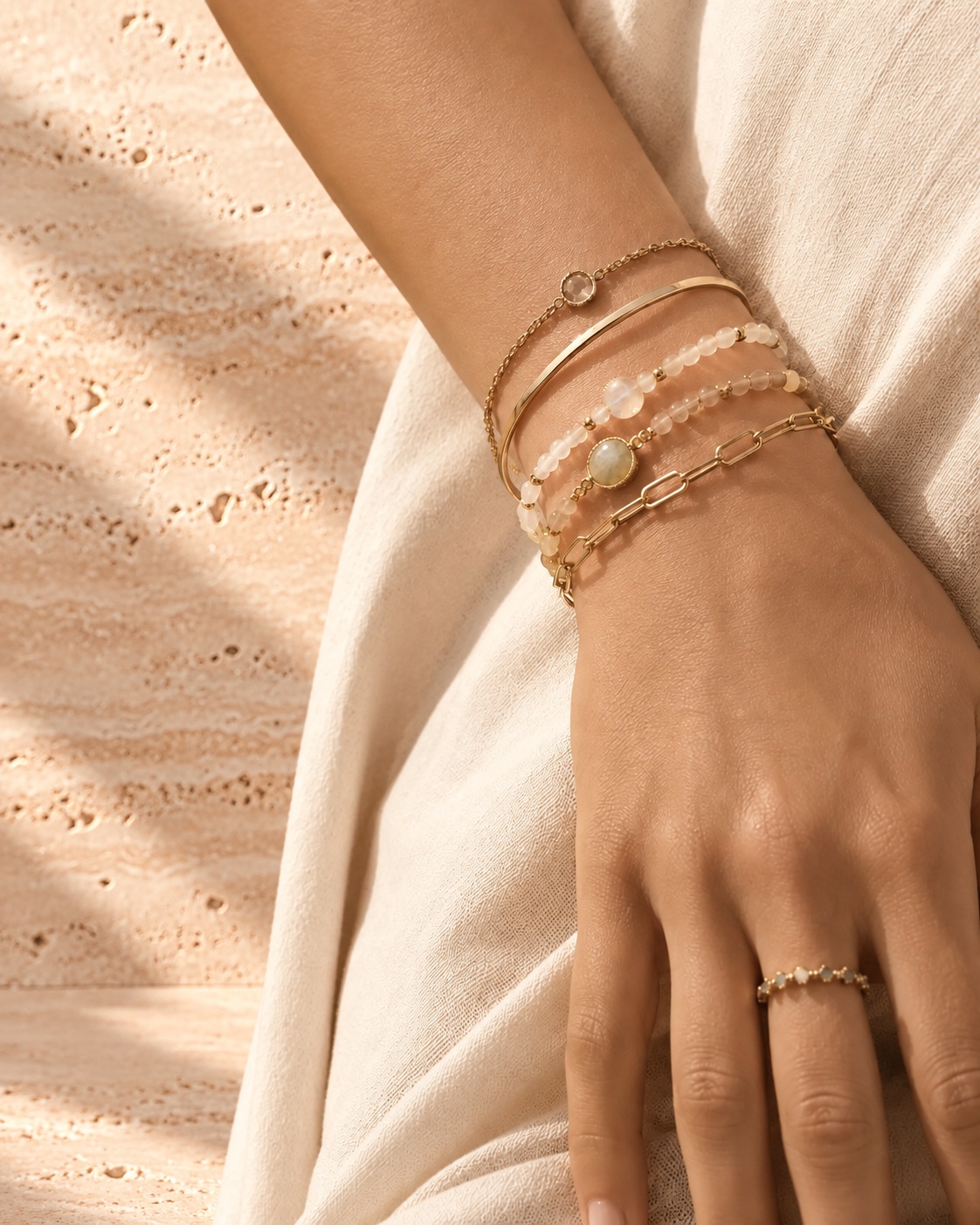 Stacked beaded bracelets on a wrist