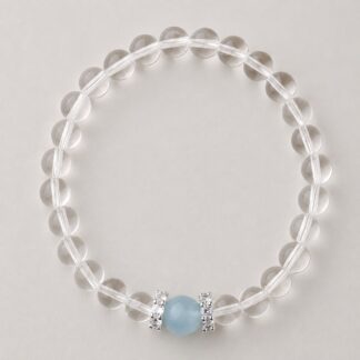 Single clear round-bead bracelet with pale blue focal accent, approximately 6 mm beads