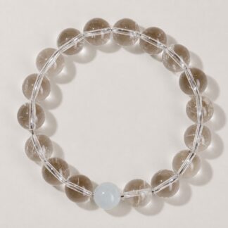 Single clear round-bead bracelet with pale blue focal accent, approximately 10 mm beads