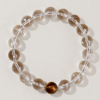 Single clear round-bead bracelet with tiger-eye brown focal accent, approximately 10 mm beads