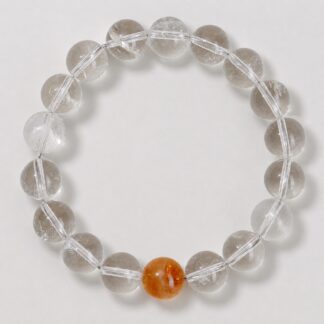 Single clear round-bead bracelet with honey yellow focal accent, approximately 10 mm beads