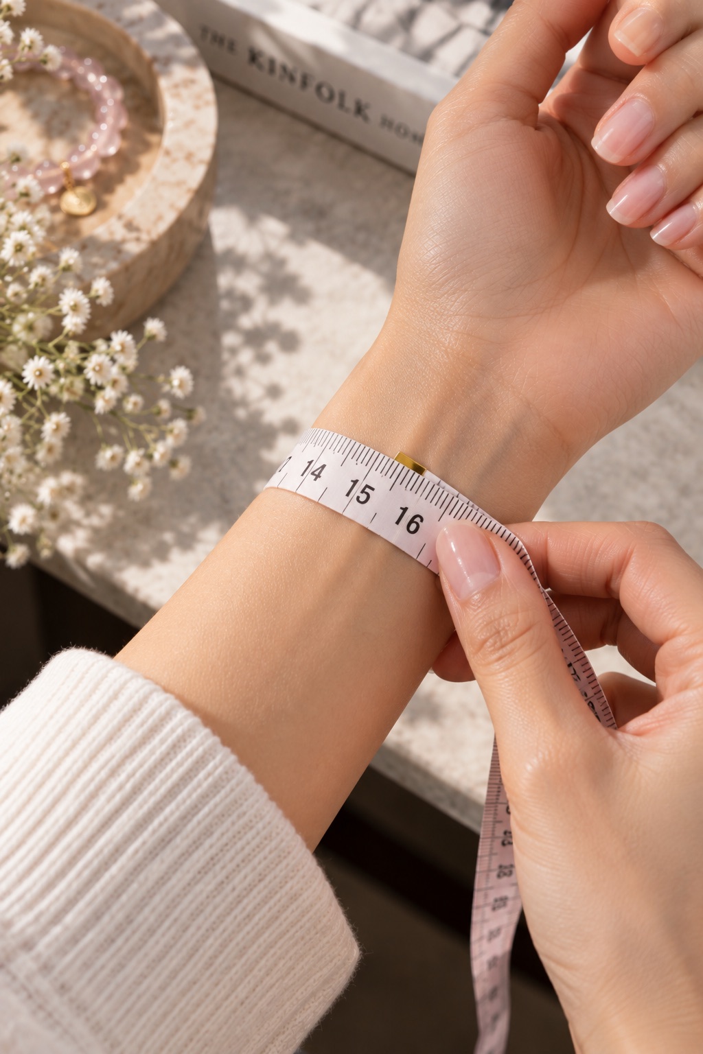 Flexible measuring tape wrapped around a wrist